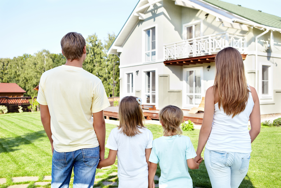 Family looking at their house
